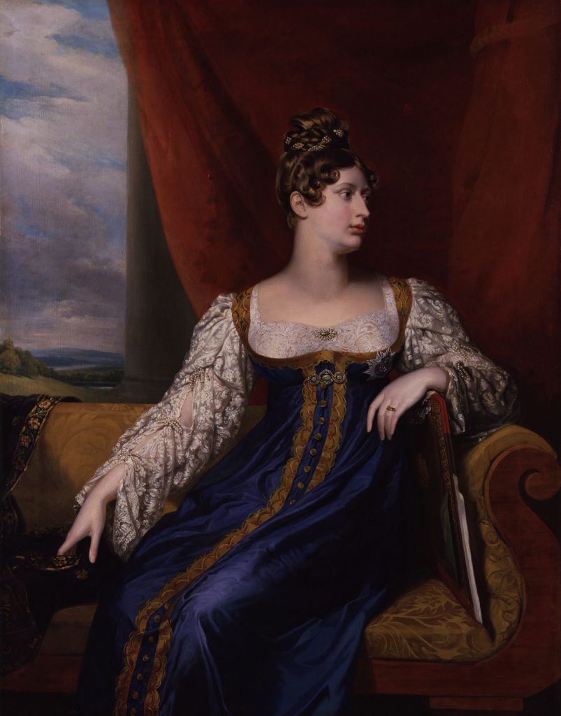Princess Charlotte in blue dress, seated